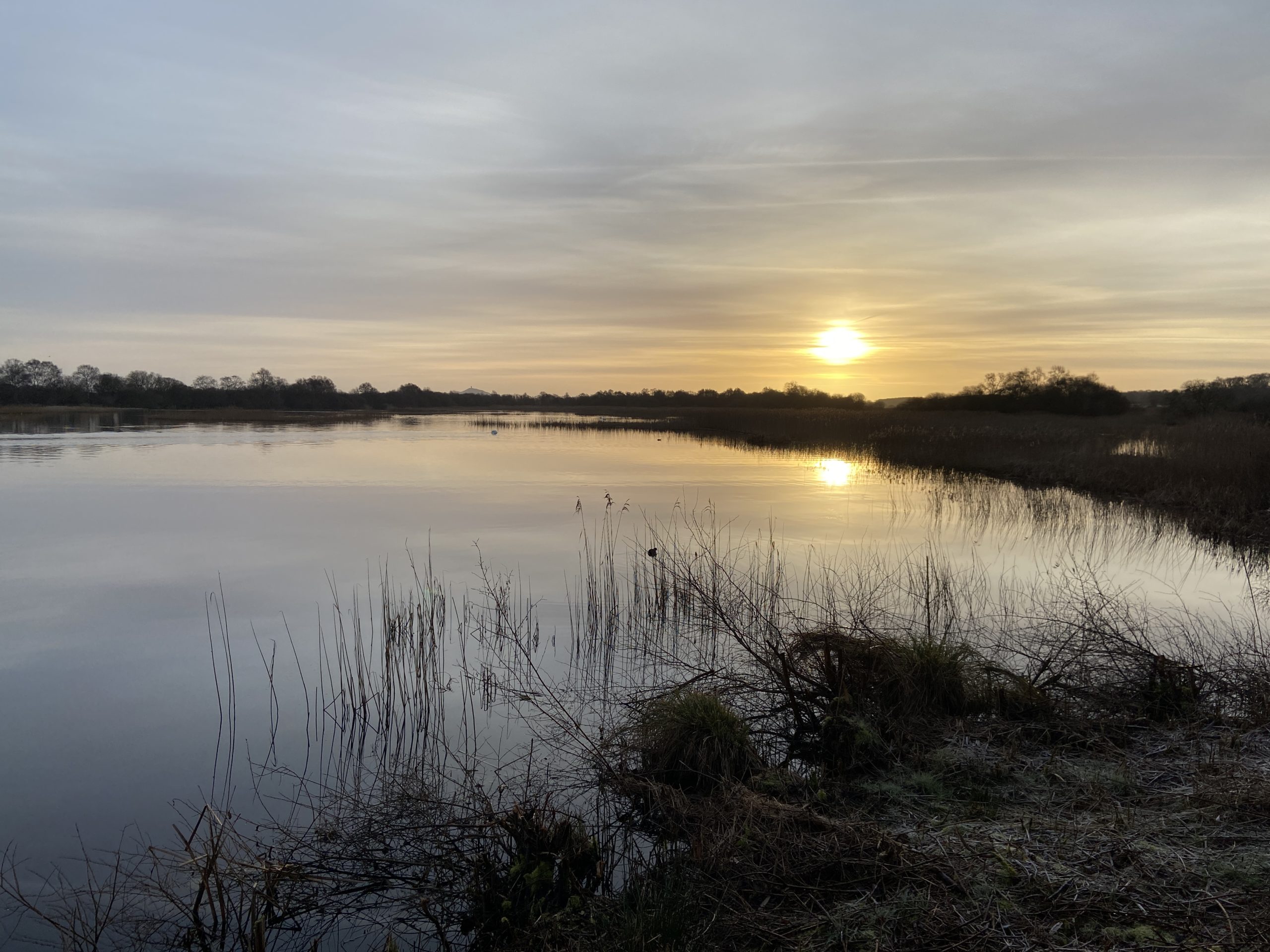 sunrise over still water